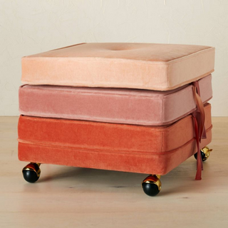 Stackable pouf in orange, pink, and salmon